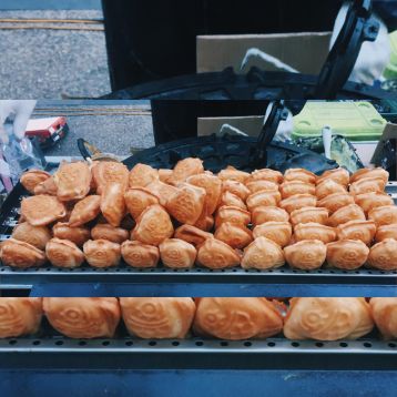 This fish-shaped bread is served hot and is usually filled with sweet red bean paste, however, this store had a custard option too.